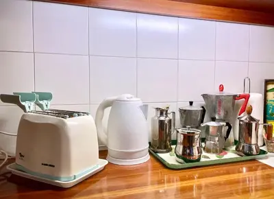 a kitchen counter with a toaster and other kitchen appliances at Very Special Place in the heart of Rome in Rome