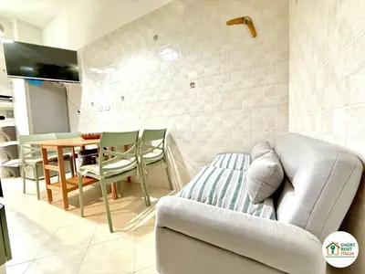 a living room with a couch and a table at San Giovanni - Minerva House in Rome