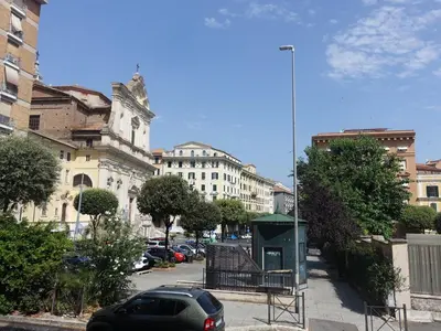 a car parked in a parking lot in a city at PiccoloPrincipeAirbnb - Saint Peter area in Rome