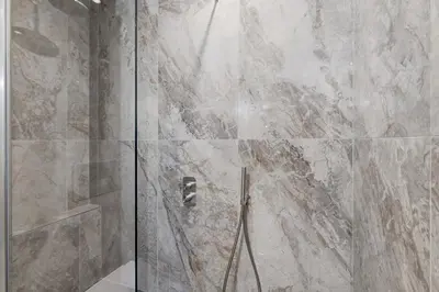 a shower with a glass door in a bathroom at La Dimora di Piazza Mazzini in Rome