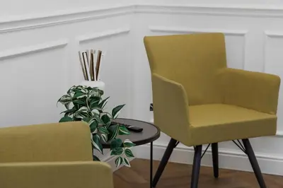 two yellow chairs and a table and a plant at La Dimora Luxury Piazza Mazzini in Rome