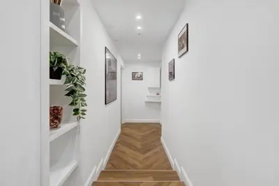 a hallway with white walls and white shelves at La Dimora Luxury Piazza Mazzini in Rome