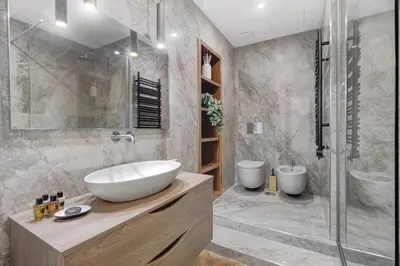 a bathroom with a white sink and a shower at La Dimora Luxury Piazza Mazzini in Rome