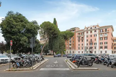 a bunch of motorcycles parked in a parking lot at Piazza Mazzini Suite con Vasca Idromassaggio in Rome