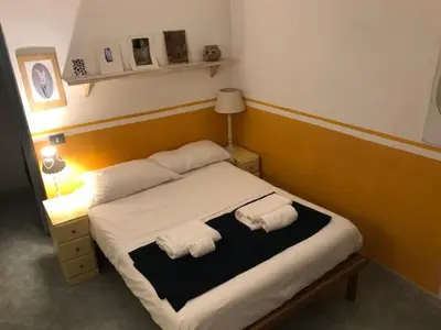 a bedroom with a bed with two towels on it at Centralissima Collegatissima in Rome