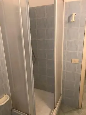 a shower with a glass door in a bathroom at Centralissima Collegatissima in Rome