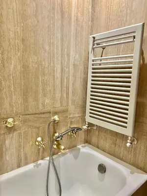 a bathroom with a white sink and a window at San Pietro Charme in Rome