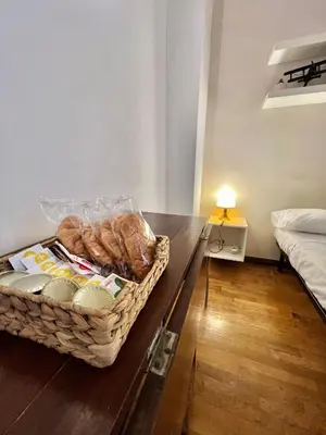 a basket of bread sitting on a table in a room at San Pietro Charme in Rome