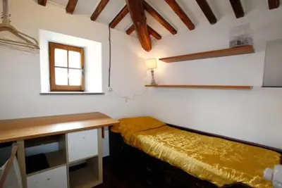 a room with a desk and a bed in it at 931 Rome Montefiore apartment in Rome