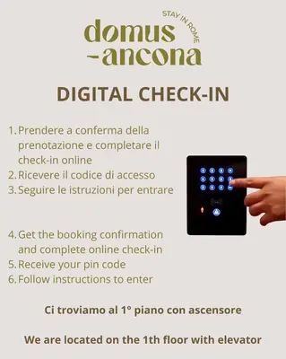 a hand holding a remote control in a flyer at Domus Ancona in Rome