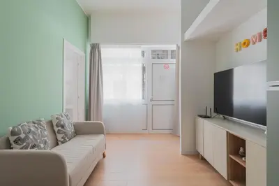 a living room with a couch and a flat screen tv at ZanzurMiddleHouse Apartment in Rome