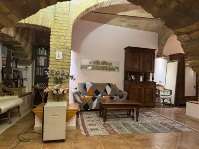 a living room with a couch and a table at DOMUS DIANE MONTI Apartment in Rome