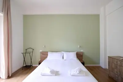 a bedroom with a large white bed with two white pillows at HC - Charming Apartment in Vigna Clara in Rome