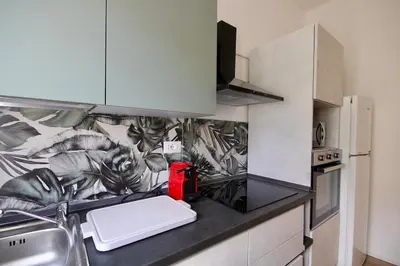a kitchen with a sink and a counter top at HC - Charming Apartment in Vigna Clara in Rome