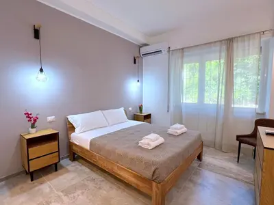 a bedroom with a bed with two towels on it at Casa della Musica - Guesthouse in Rome