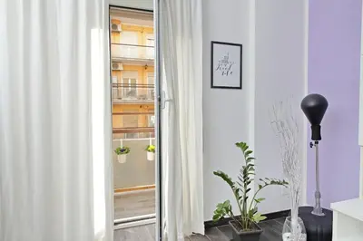 a room with a sliding glass door with plants at Makà, una struttura dal fascino unico in Rome