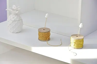 three objects on a white shelf with a vase at Makà, una struttura dal fascino unico in Rome