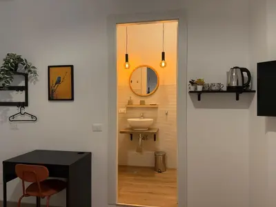 a bathroom with a sink and a mirror at B&B Loggia Garbatella in Rome