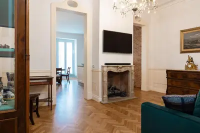 a living room with a fireplace and a television at Candy Lodge in Rome