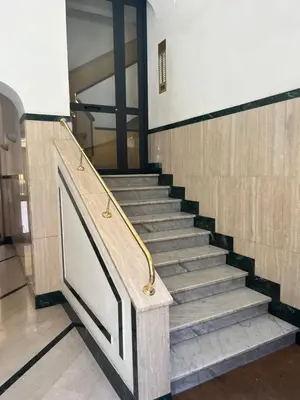 a set of stairs in a building with a door at Enjoy Rome San Paolo Retreat in Rome