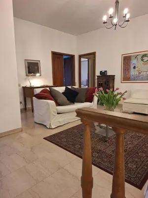a living room with a couch and a table at Apartment Rome Parioli near Villa Borghese in Rome