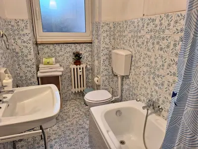 a bathroom with a sink and a toilet and a tub at Apartment Rome Parioli near Villa Borghese in Rome