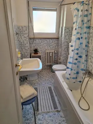 a bathroom with a tub and a sink and a toilet at Apartment Rome Parioli near Villa Borghese in Rome