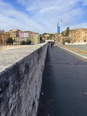 a concrete wall on the side of a street at Maison Manú - Vaticano in Rome