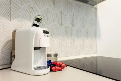a coffee maker sitting on top of a counter at Maison Manú - Vaticano in Rome