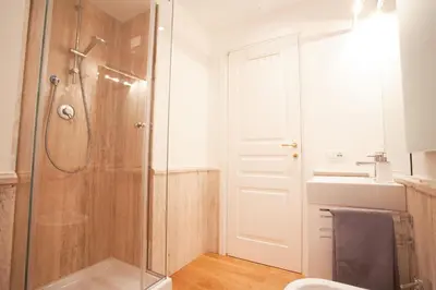 a bathroom with a shower and a sink at Corso 277 Apartment in Rome