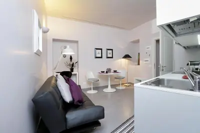 a living room with a couch and a table at Residenza Romana Zucchelli in Rome