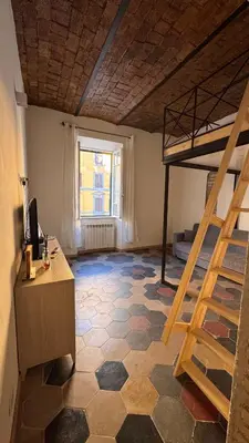 a room with a desk and a bunk bed at Casa Francesco in Rome