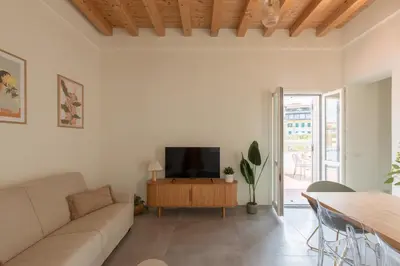 a living room with a couch and a tv at iFlat Scenic Penthouse with Terrace near Vatican in Rome