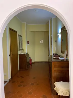 a glass door of a building with a brick wall at Vatican Lodge in Rome