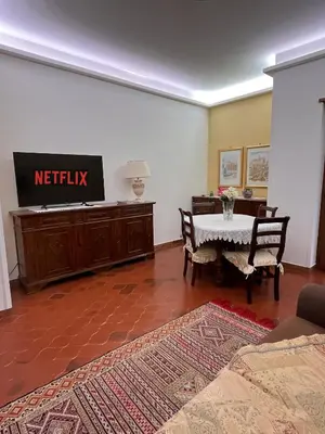 a living room with a couch and a table at Vatican Lodge in Rome