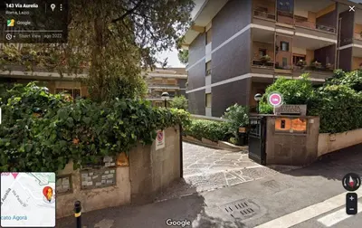 a building with a parking meter in front of it at Le tue Notti a San Pietro in Rome