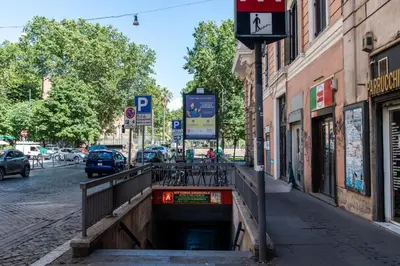 a tunnel in the middle of a street with cars at Boutique apartment 10 min to Colosseum and Termini in Rome
