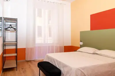 a bedroom with a bed and a window at Boutique apartment 10 min to Colosseum and Termini in Rome
