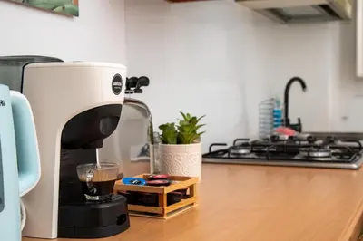 a coffee maker sitting on a counter in a kitchen at Boutique apartment 10 min to Colosseum and Termini in Rome