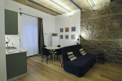a living room with a couch and a table at Appartamento Pigneto in Rome
