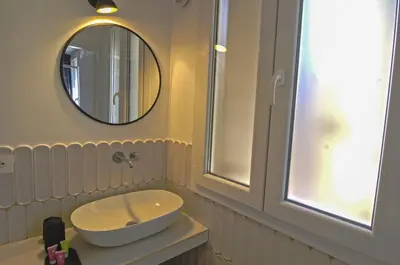 a bathroom with a sink and a mirror at Appartamento Pigneto in Rome