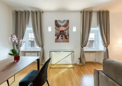 a living room with a table and a couch at Vittoriano Pantheon apartment in Rome