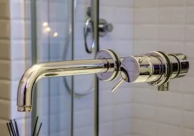 a shower with a silver handle in a bathroom at Vittoriano Pantheon apartment in Rome
