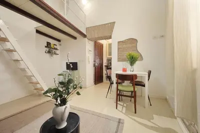a living room with a loft bed and a couch at Quiet nest in Campo De' Fiori in Rome