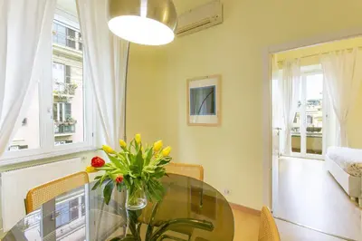 a bedroom with a bed and a large window at Rome Central Suite via Porcari in Rome