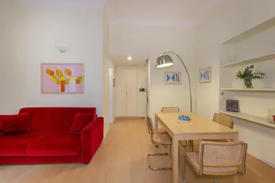 a living room with a blue couch and a table at Rome Central Suite via Porcari in Rome