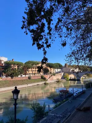 a view of a river with a bridge in the background at Casa di Ross in Rome