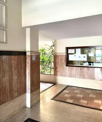 a living room with a large mirror on the wall at Casa di Ross in Rome