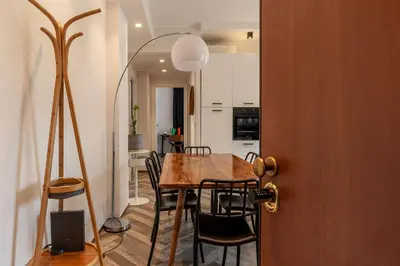 a kitchen and dining room with a table and chairs at GuestHost - Colorful Apt in Vintage-Modern Style in Rome