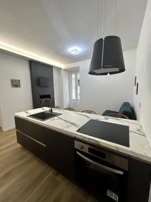 a kitchen with a sink and a counter top at Roma city center stay San Giovanni in Rome